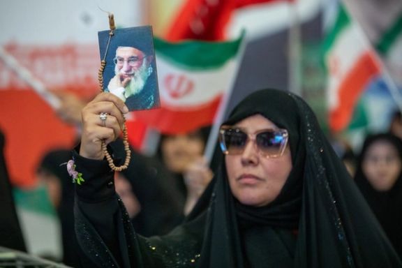 A woman wearing shades and chador attends a Tehran rally to commemorate the commanders killed in Israeli strikes, July 1, 2025
