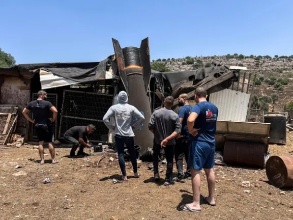 People look at apparent remains of a ballistic missile following missile attack by Iran on Israel, in northern Israel, June 24, 2025.
